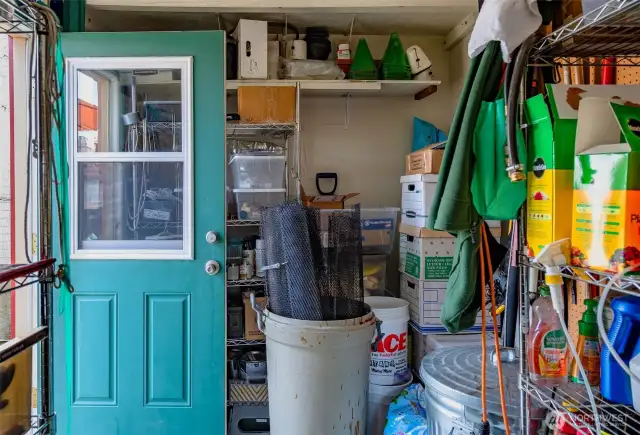 Whimsical walkway leads you to the spacious, insulated shop shed w/windows, and more!