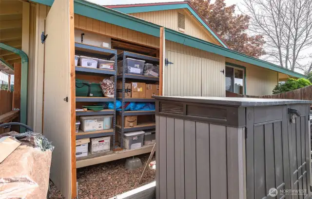 Owners built these amazing under-eave storage cabinets on both ends of the house! They blend seamlessly. Additional shed also included!