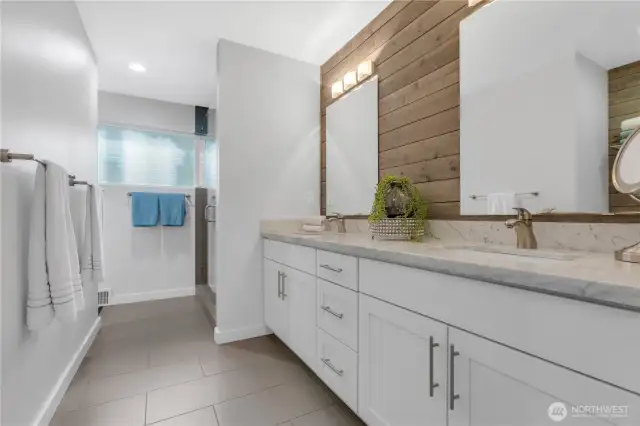 Primary bathroom with heated floors, shower and custom closet