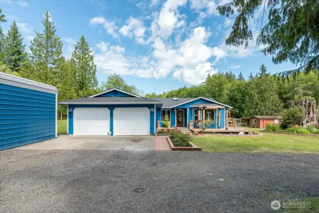 Front Exterior of 29007 2nd Ave NW. 2 car garage has mini split (2021).