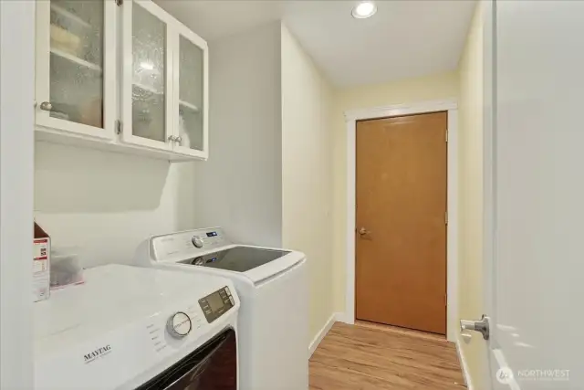 Washer/dryer with access to garage.