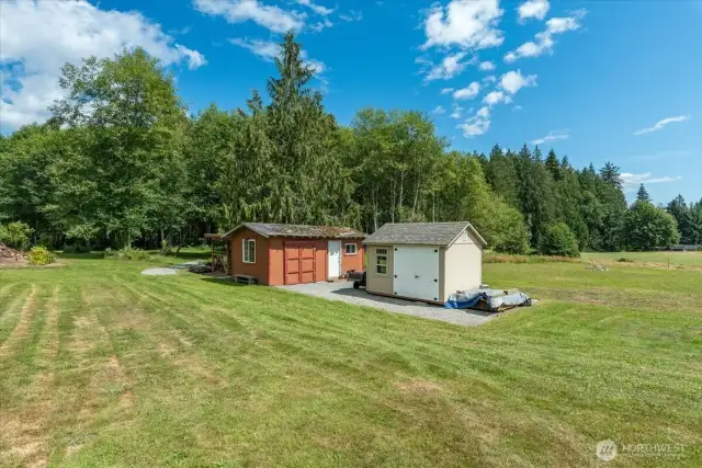 Shed on the left is original, shed on the right is 2019 - great for storage, lawn tools, etc. This shed is from Costco & has a electrical box installed.