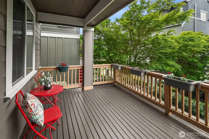 Relax and unwind on the partially covered patio, with a glimpse of surrounding mountains.