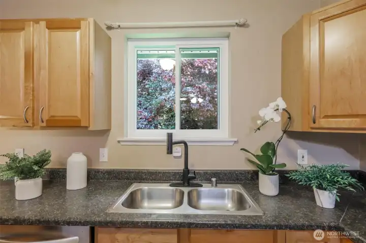 The kitchen window has a lovely private view of the trees.