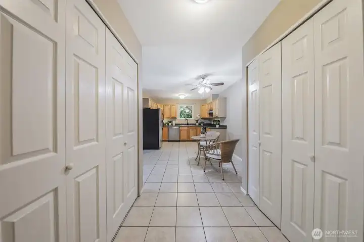 This is the view from the entry looking toward the kitchen. Notice all of the closet storage. The washer and dryer are in the closet on the left.