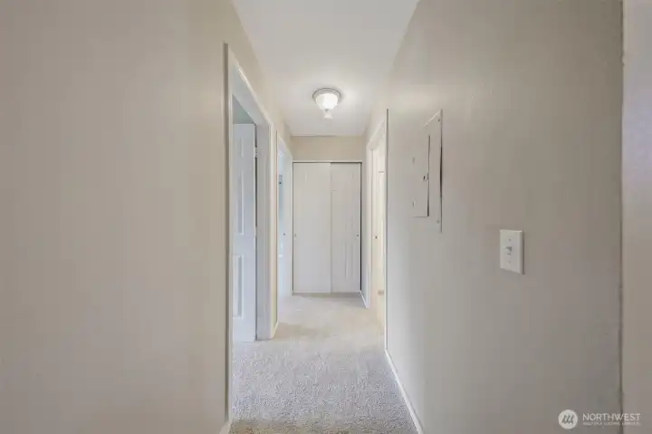 From the entry when you look staight ahead you see the hallway to the bedrooms with another storage closet at the end.