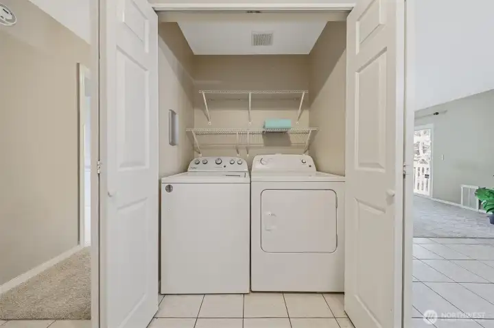 The washer and dryer are full size and can be closed off behing closet doors.