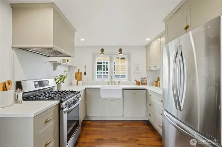 Bright, remodeled kitchen with a farmhouse sink and modern finishes.