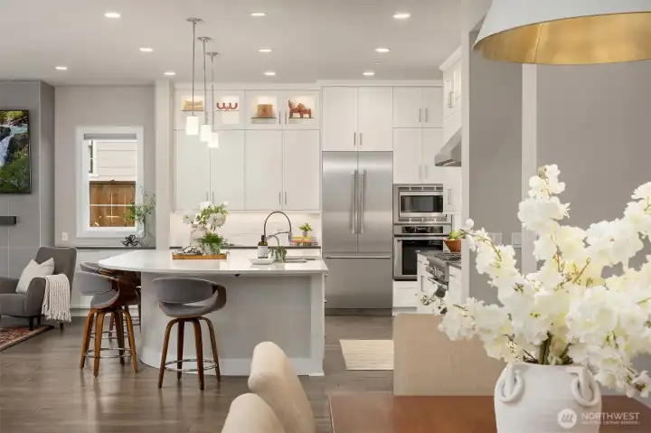 View of kitchen and living room from dining area
