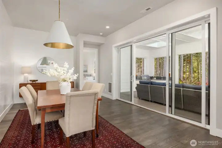 Dining area opens to huge covered porch/patio inviting year round entertaining and relaxation
