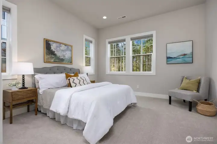 Guest suite on main level with views to the beautiful trees beyond