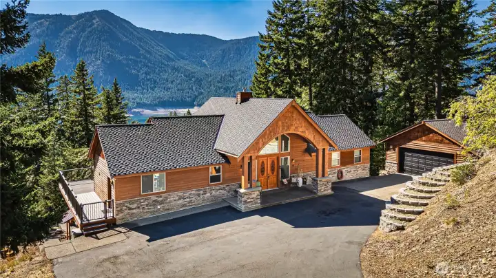 Paved entry, gated driveway, garage