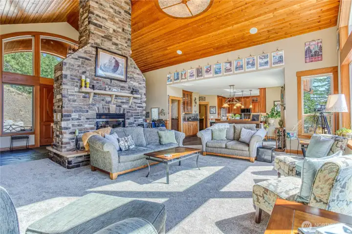 Expansive main living room has cathedral ceilings, lots of light, & an open floor plan