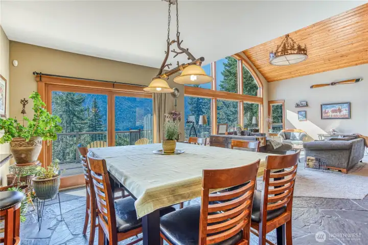 Dining area between kitchen & living areas has slider to the deck