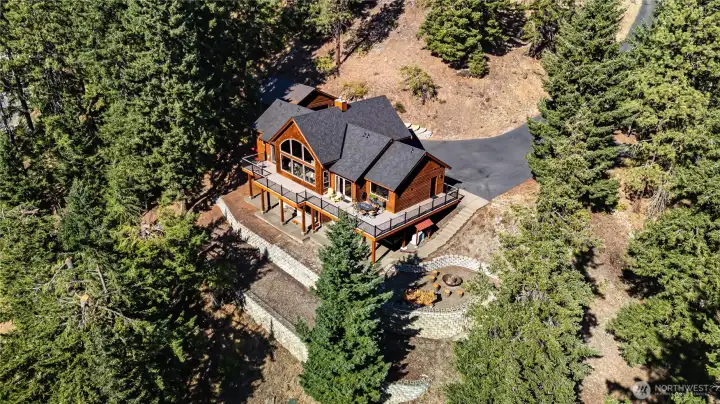 Aerial view of the home & garage. Lots of trails & recreation nearby.
