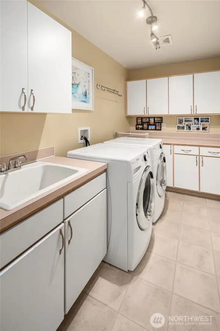 Spacious utility room off garage.