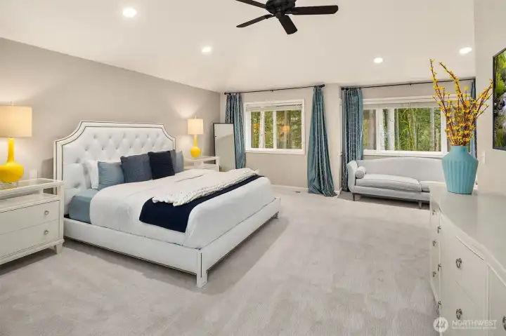 Luxurious primary suite with two walk in closets, and spa like bathroom.