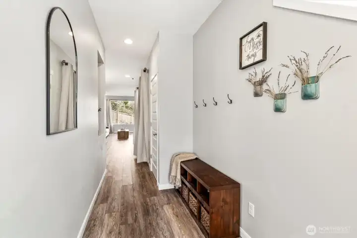 Bright entry hallway with updated flooring and clean, modern finishes throughout.