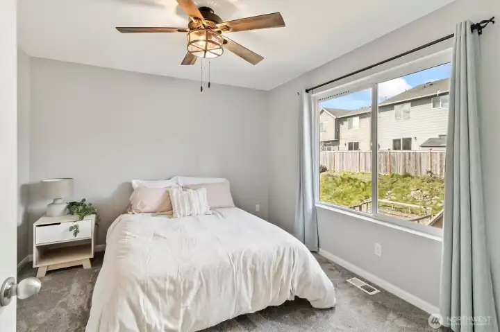 Third bedroom with backyard views.