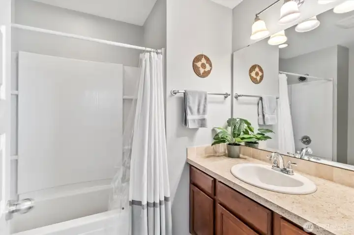 Full bathroom with modern fixtures and clean finishes.