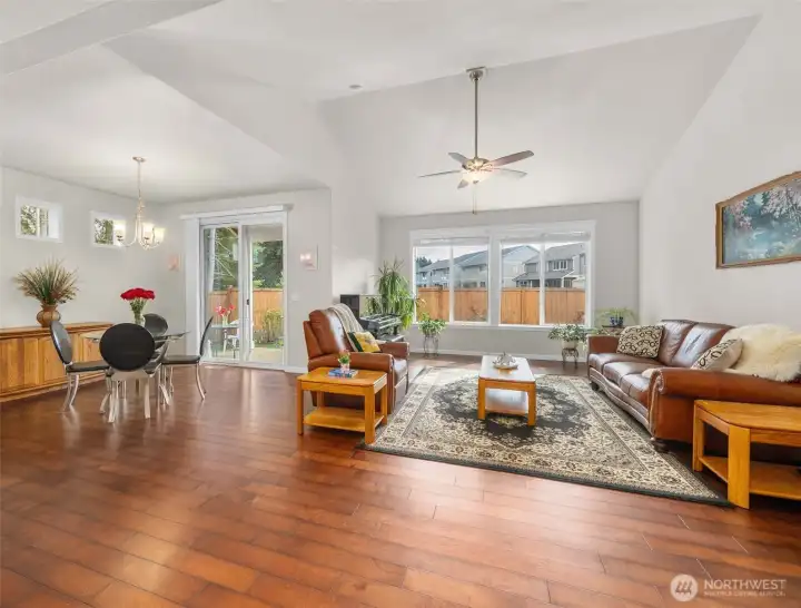 Expansive great room flows into the breakfast nook with direct access to the covered patio—perfect for seamless indoor-outdoor living and year-round enjoyment.