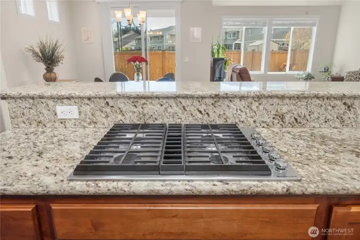 Gas cooktop set into the island allows you to cook, connect, and stay part of the conversation while entertaining.