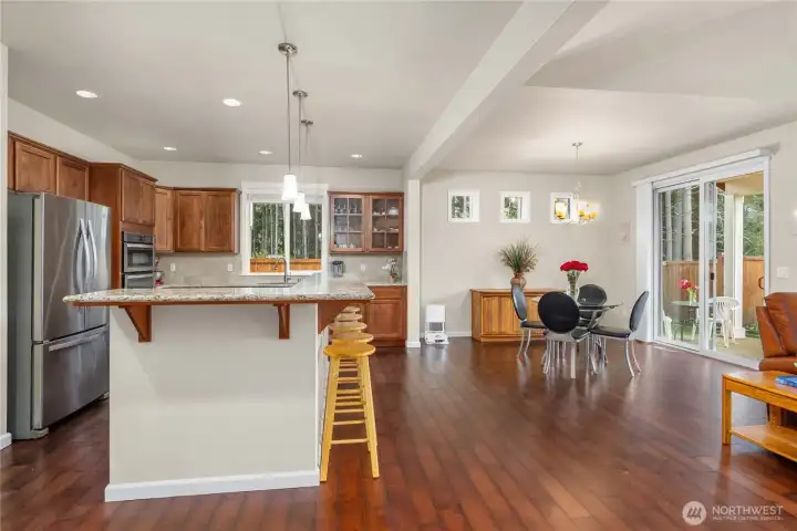 Open sight lines from the kitchen extend into the breakfast nook, great room & covered patio, enhancing the home’s connected layout.