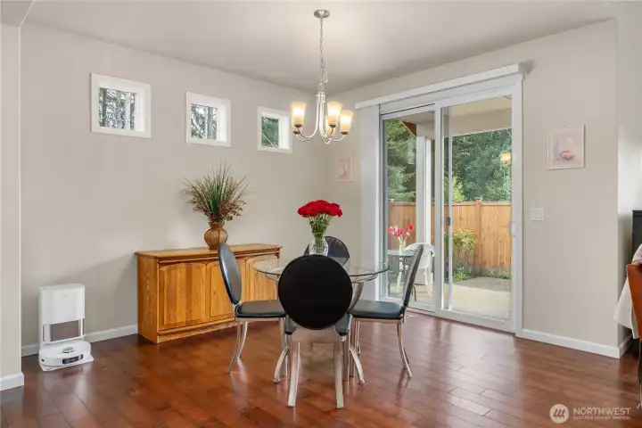 Bright breakfast nook with direct access to the covered patio—perfect for casual meals and easy indoor-outdoor living.