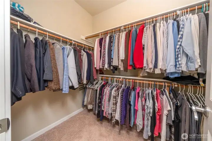 Large walk-in closet with extensive hanging space keeps everything organized and easily accessible.