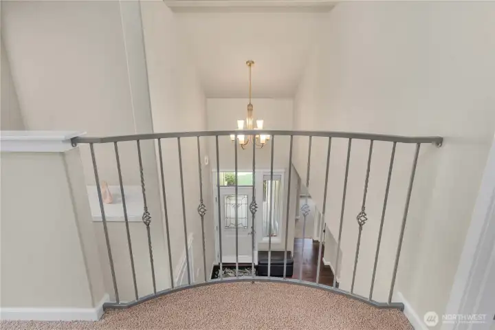 Open upper landing overlooks the main level, creating an airy feel.