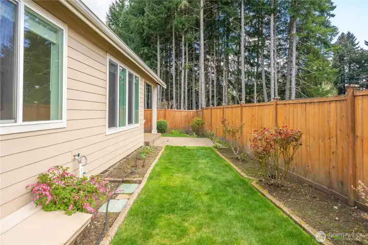 Fully fenced, private backyard complete w/sprinker system AND no neighbors behind—offering added peace, seclusion, and a quiet outdoor setting.