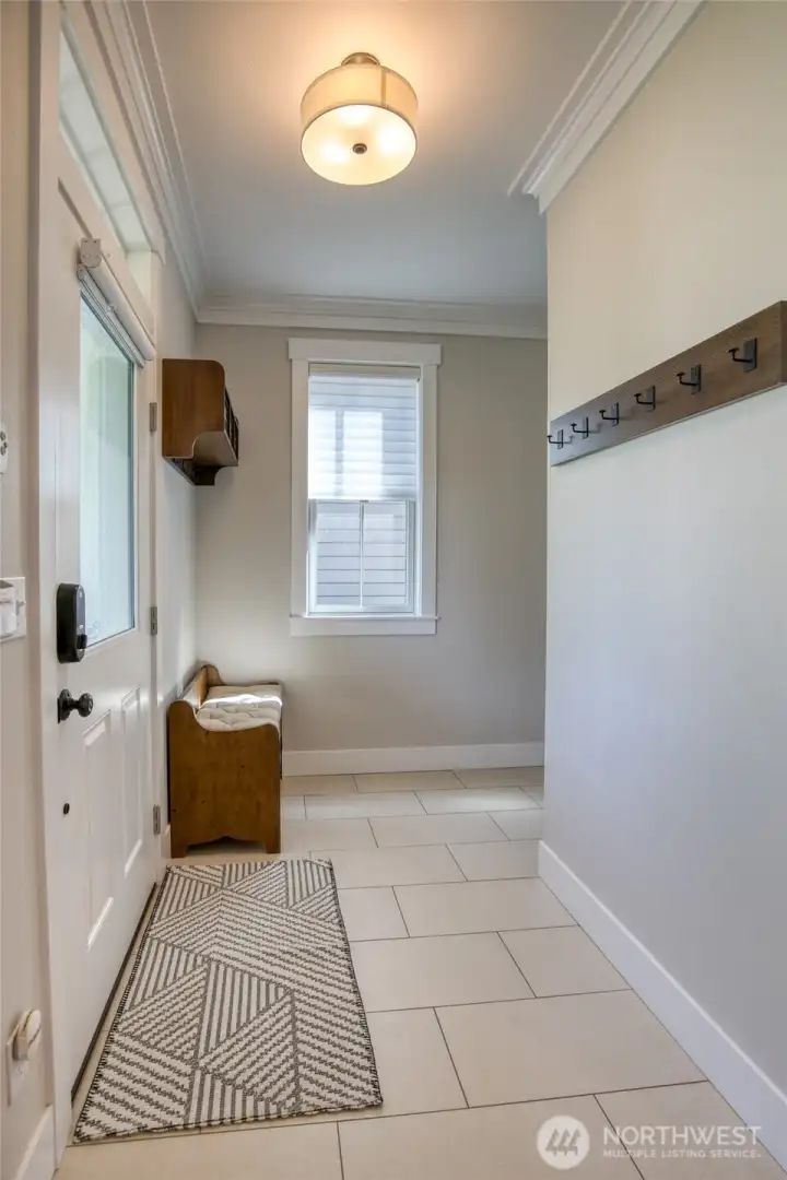 The entry is spacious with storage and entry closet. The tiles floors make it stress free!
