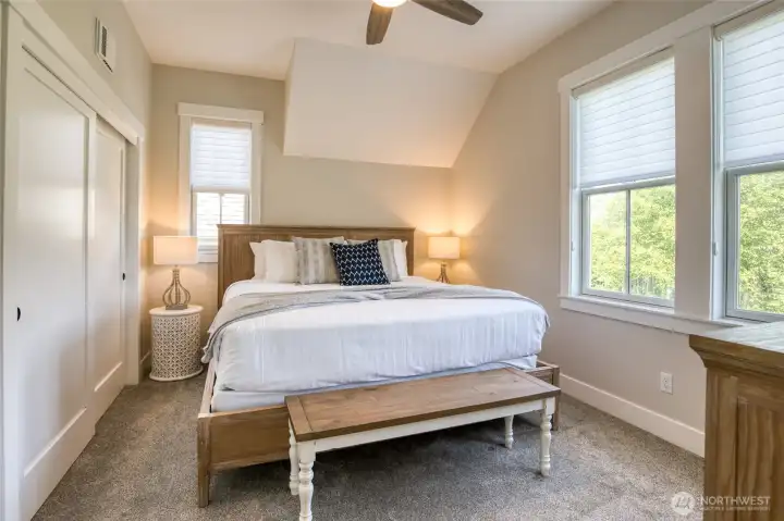 The primary suite is located on the West side of the home and overlooks the greenspace where deer frequent. You also have a view of the Windgate Barn and pasture.