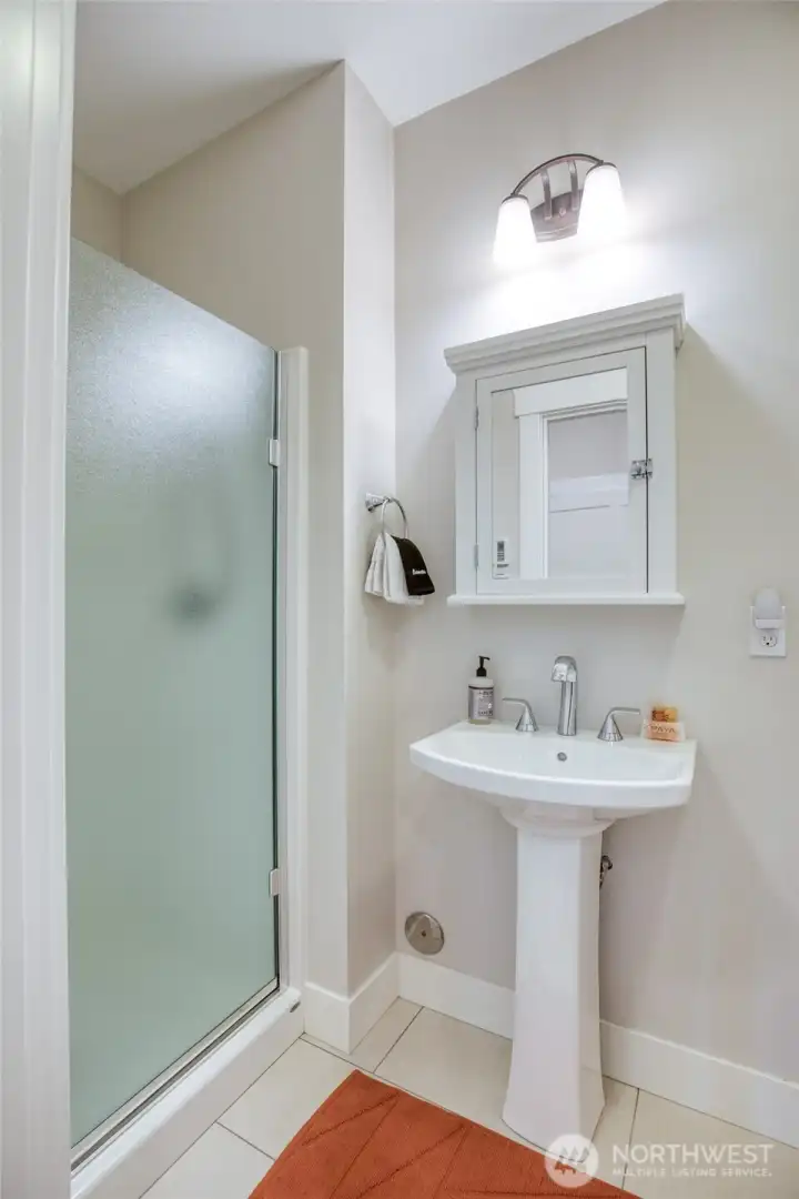 There is a hall bath, as well.