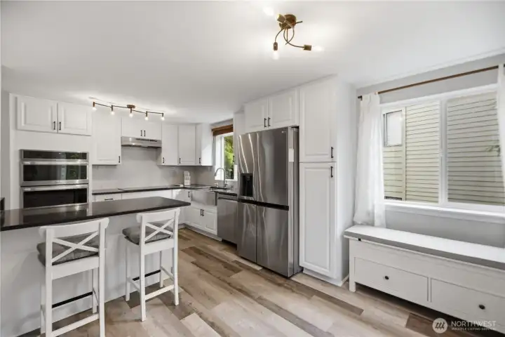 Beautiful  Kitchen Cabinets, Wine cooler New appliances, Quartz counter tops and quarts backsplash tile.