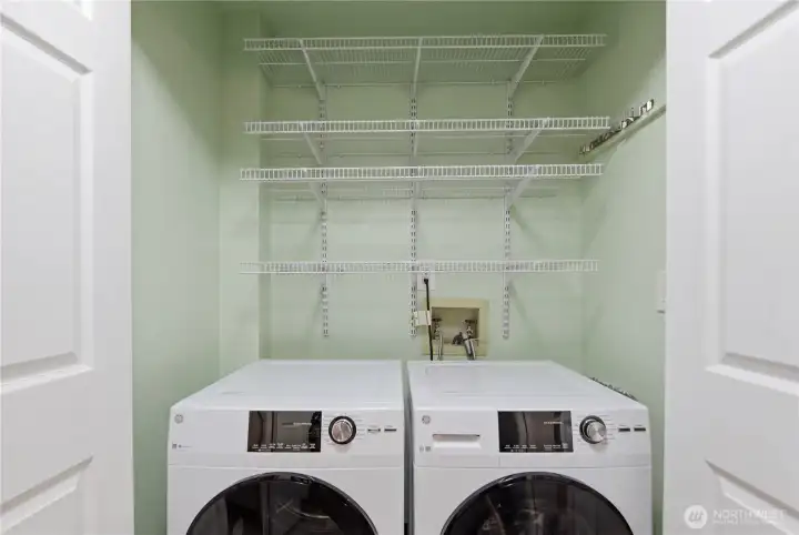 Washer and dryer included. Virtually staged photo, Items on shelf removed from photo.