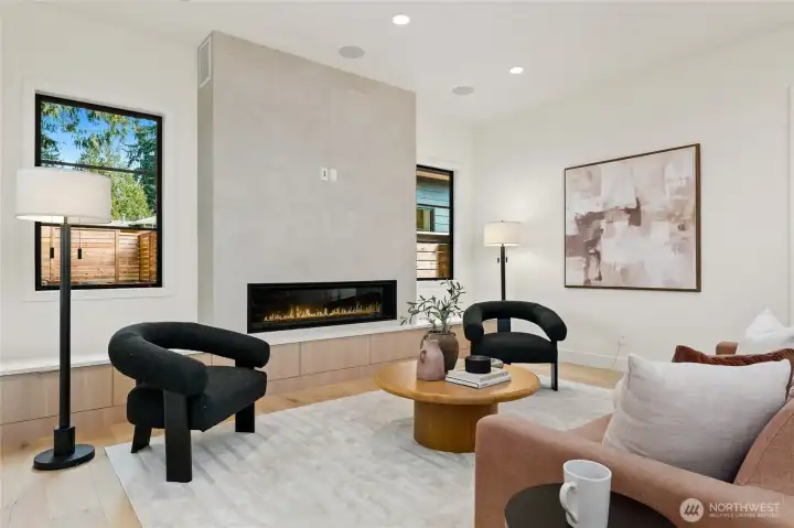 Cozy Living Room with In-Ceiling Speakers and Urbana Fireplace with Custom Built-Ins and floor to Ceiling Surround Cozy Living Room with In-Ceiling Speakers and Urbana Fireplace with Custom Built-Ins and floor to Ceiling Surround