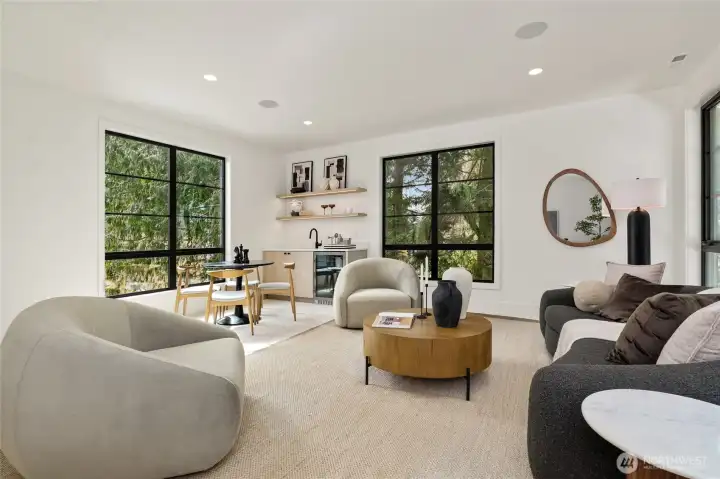 Upper Level Media Room with Wet Bar, Oversized Windows and In-Ceiling Speakers Upper Level Media Room with Wet Bar, Oversized Windows and In-Ceiling Speakers
