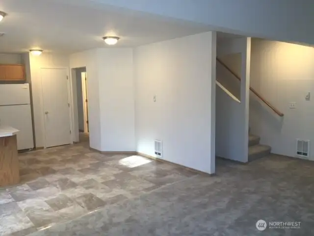 Unit B - Living with dining space and kitchen on the left