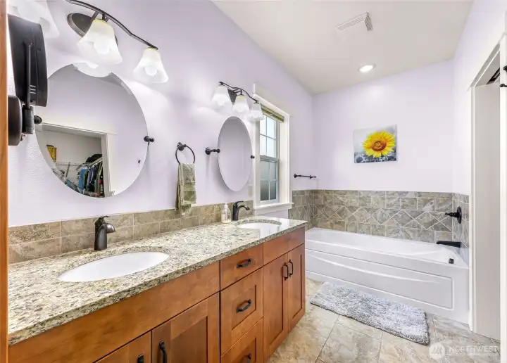 Double sinks and the granite countertop in the master suite