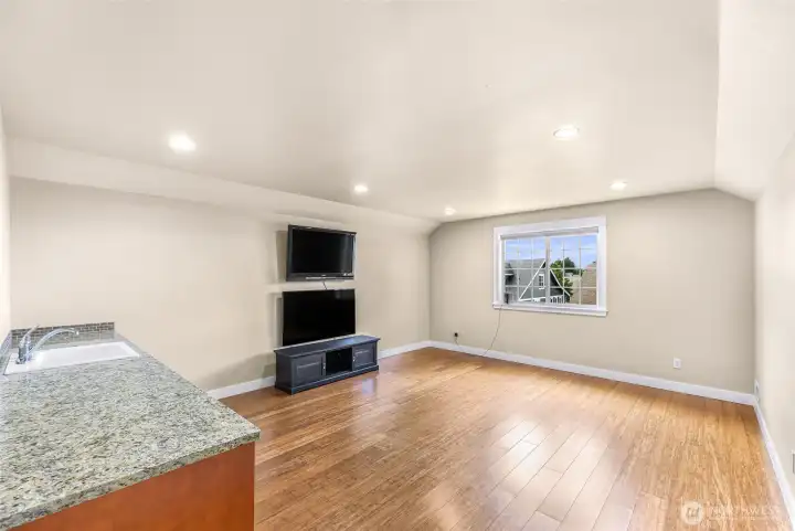 Second floor bedroom or multi-use space with wet bar
