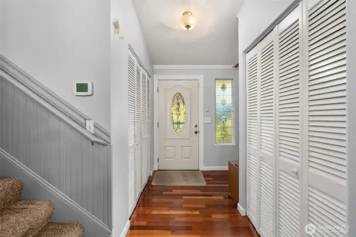 Entry with beautiful warm colored hardwood floors