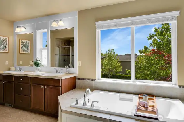 Light & bright primary bath with soaking tub, double vanity, separate water closet, walk-in shower and walk-in closet. A great place to relax!