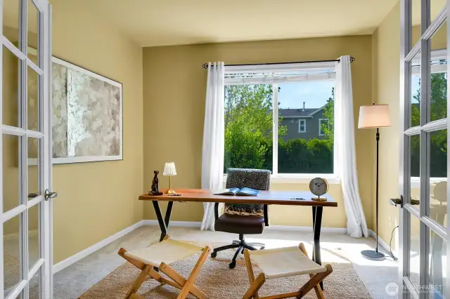 Spacious main floor den with double doors is the perfect space for working from home, or homework!