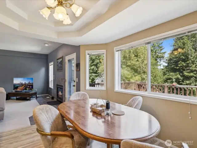 Eating area right off of the kitchen with big windows, impeccable views, and privacy.