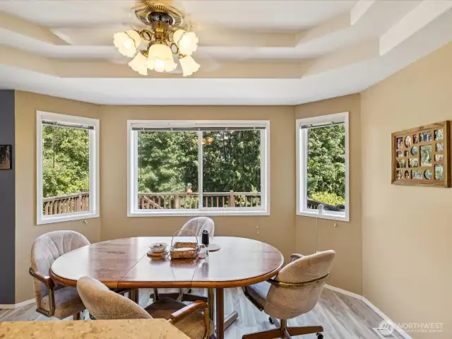Eating area with elegant recessed ceilings.