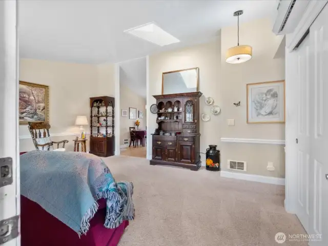 Open floor plan - Living Room has vaulted ceiling & skylight, and opens to Dining Area & Kitchen.