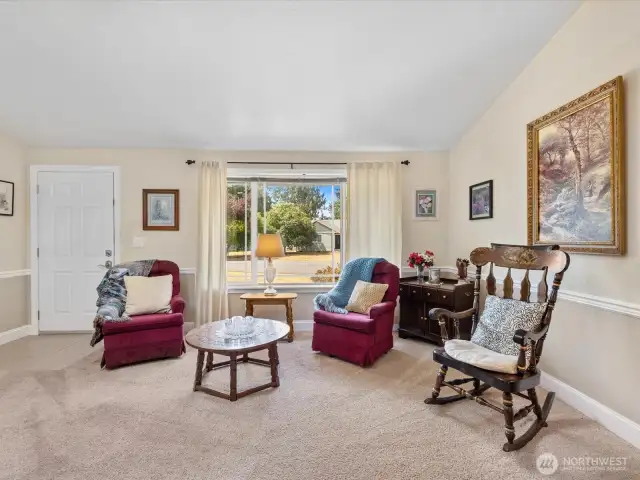 Open floor plan - Living Room has vaulted ceiling & skylight, and opens to Dining Area & Kitchen.