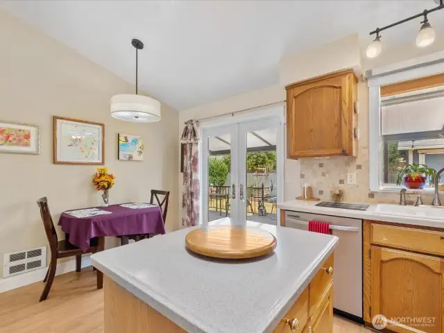 Beautiful Kitchen with vaulted ceiling, skylight,  stainless appliances, garden window & Island.