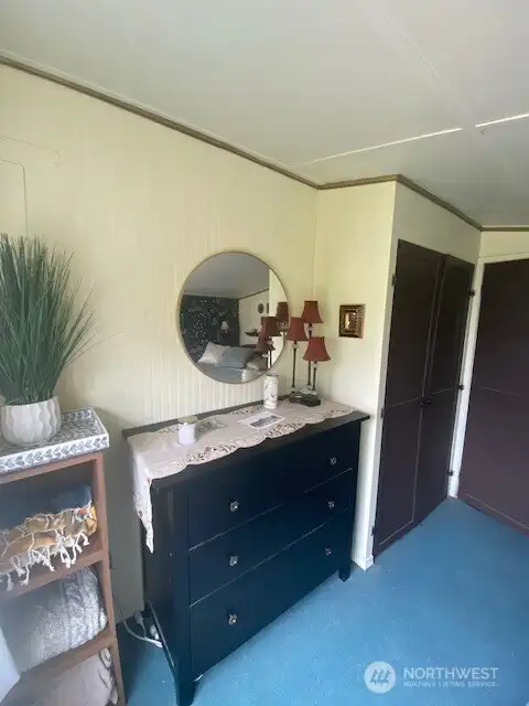 Main bedroom with view of the fully fenced yard and gardens.